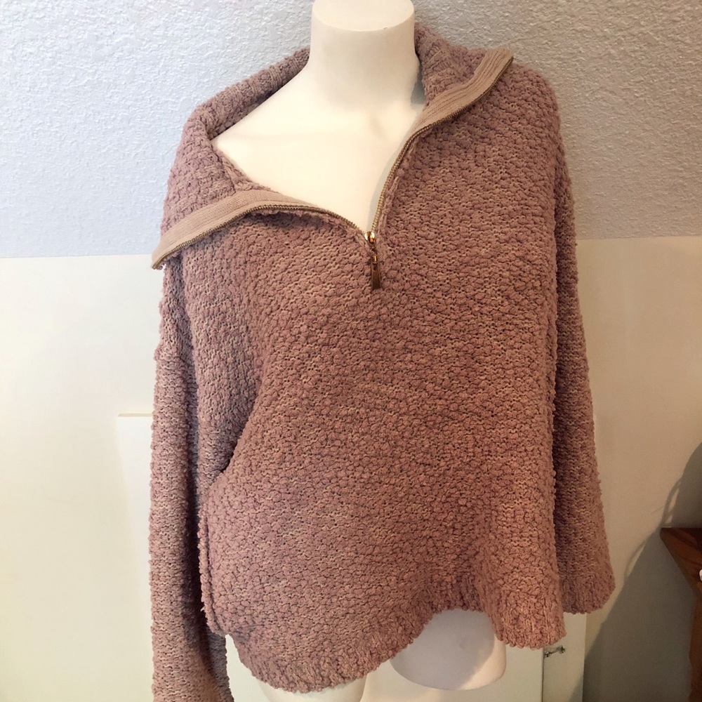 Women’s pink knit quarter zip sweater
